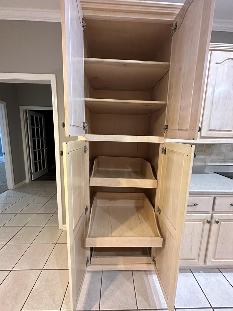 Kitchen cabinetry has several pull outs